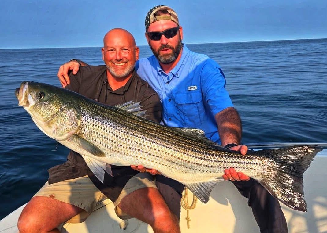 Maine striper fishing charter boat on coastal waters with fishing gear ready for 4-hour trip