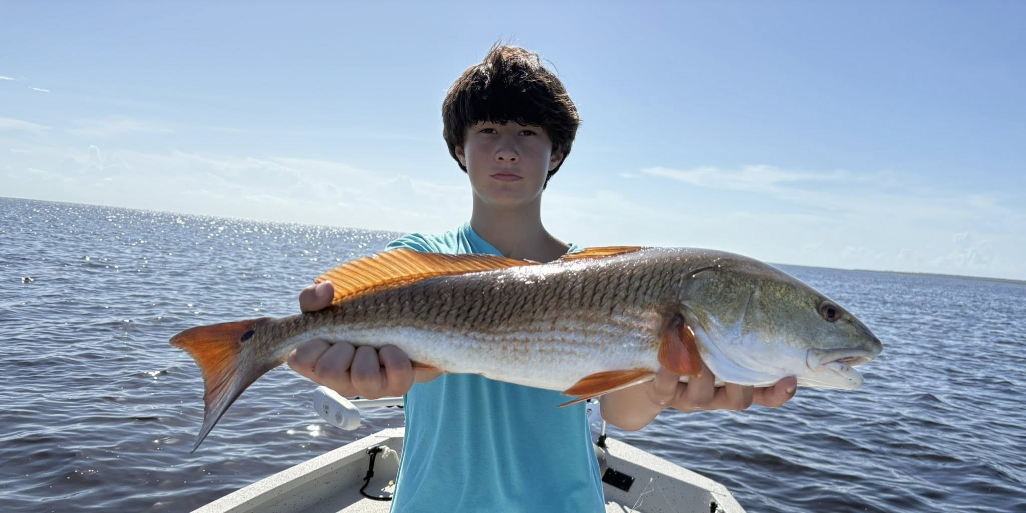 Kids fishing charter boat in Steinhatchee waters targeting trout, redfish, and flounder
