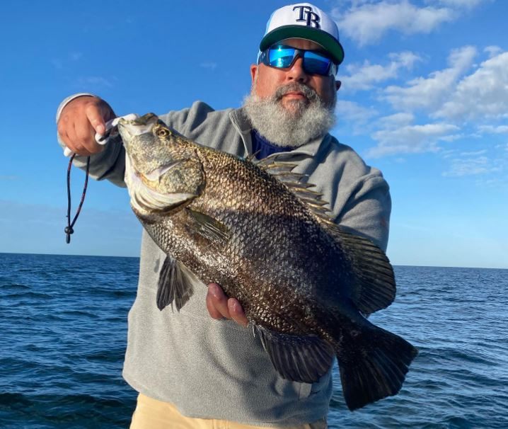 1 angler proudly displays their 17-inch catch in Sarasota