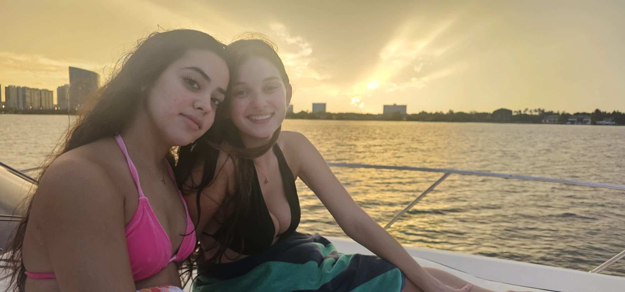 Sunset cruise on calm waters with Miami skyline in background