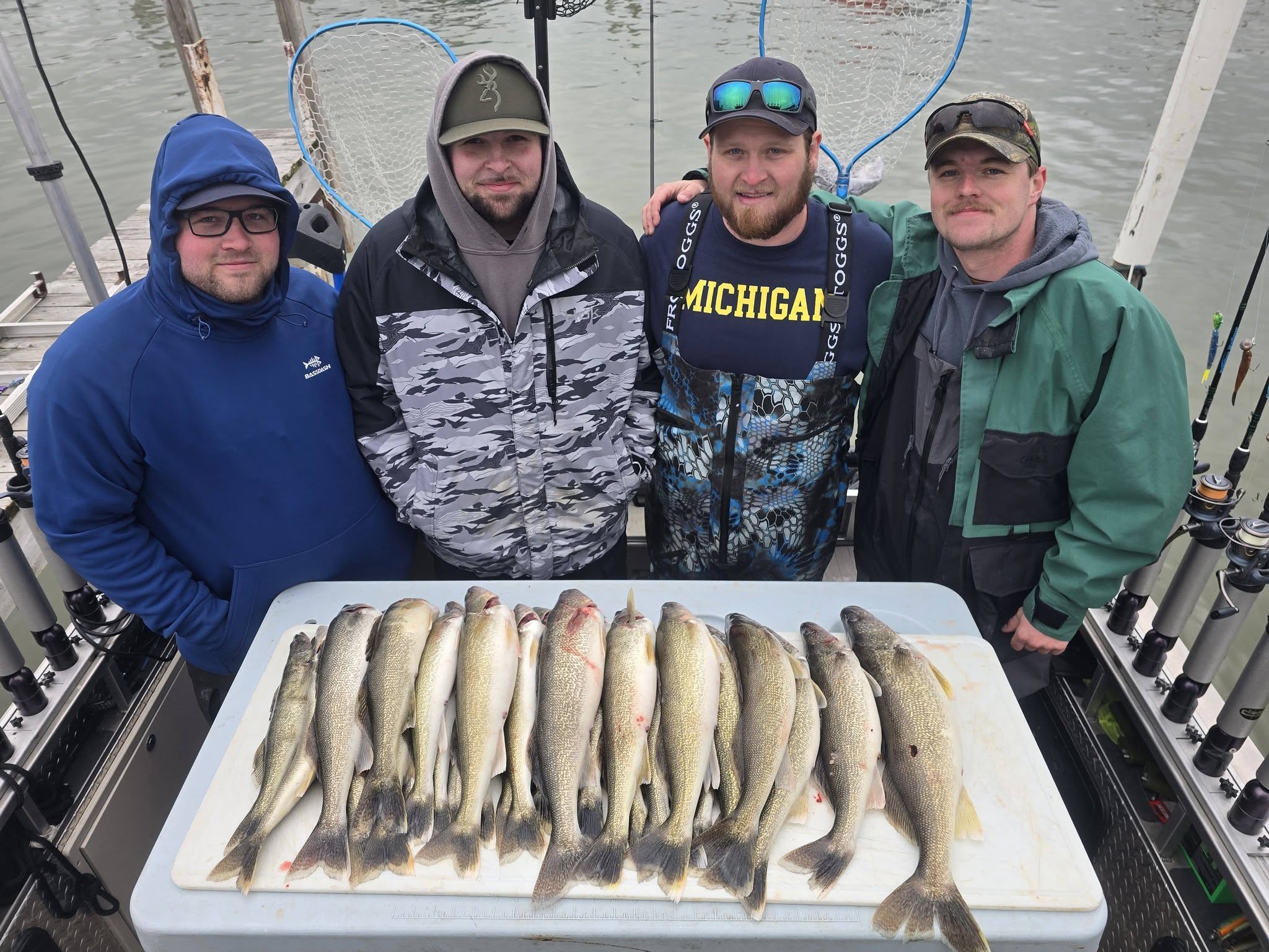 Successful walleye and sauger fishing trip in Monroe Michigan with multiple fish displayed on boat