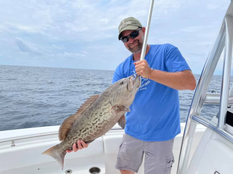 Angler with a gag grouper fish in Panama City Beach