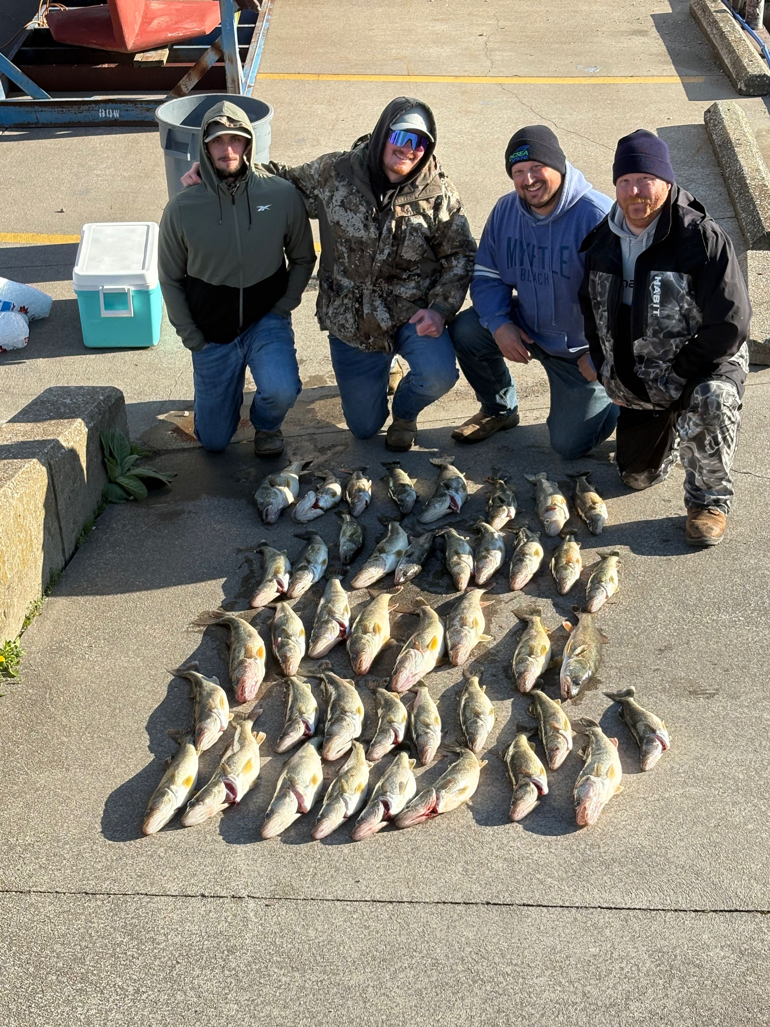 Large catch of fish displayed on dock after successful fishing trip in Medina OH