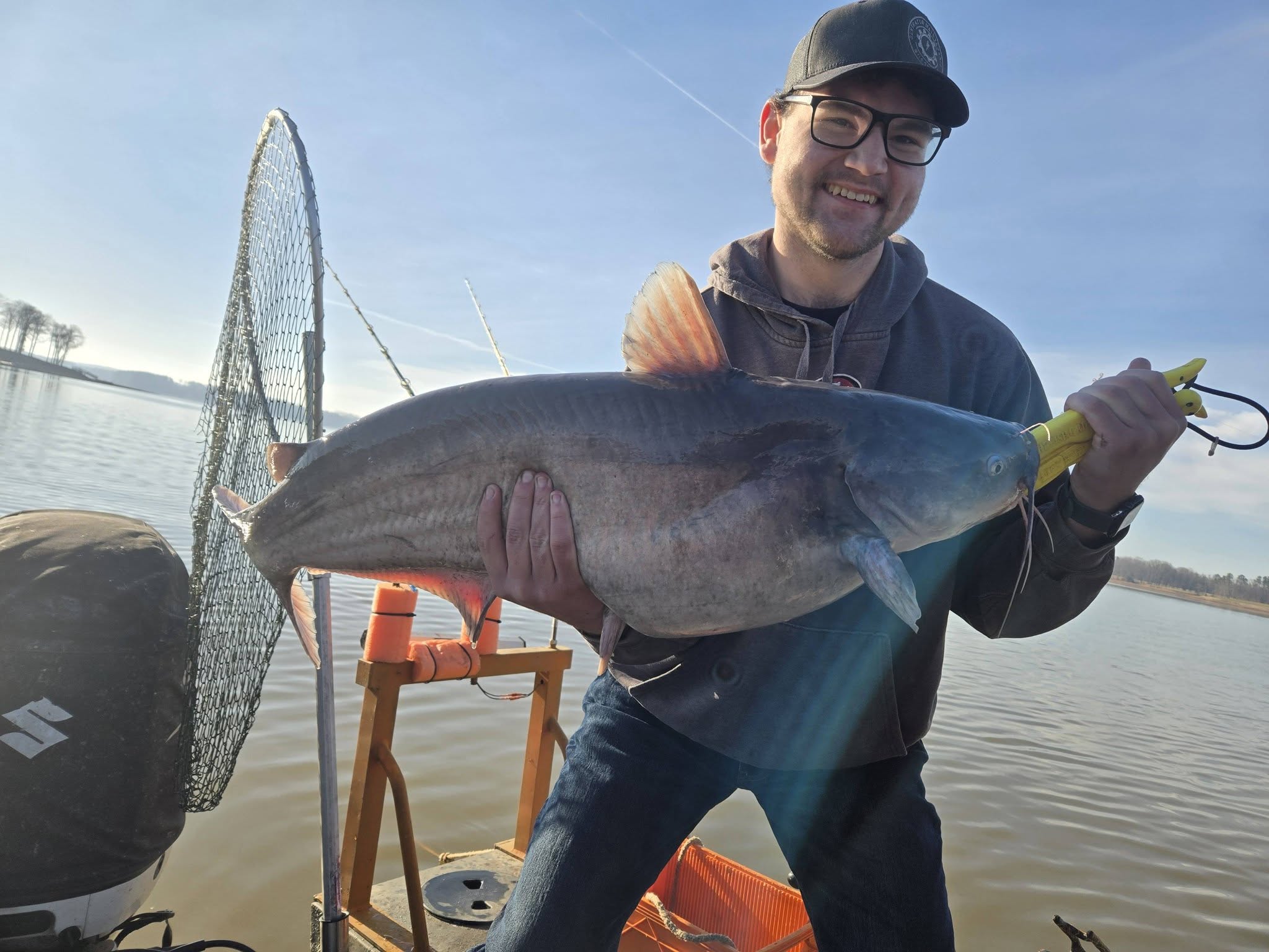 Blue catfish caught fishing in Mocksville NC held on boat with net