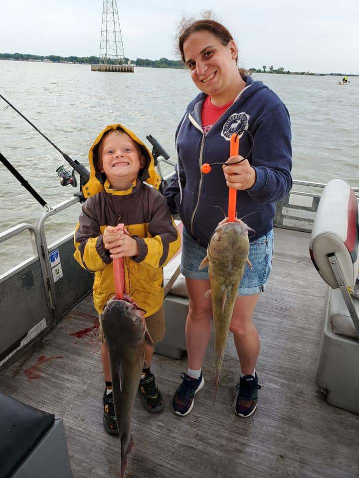 Two anglers with big fish at Port Clinton