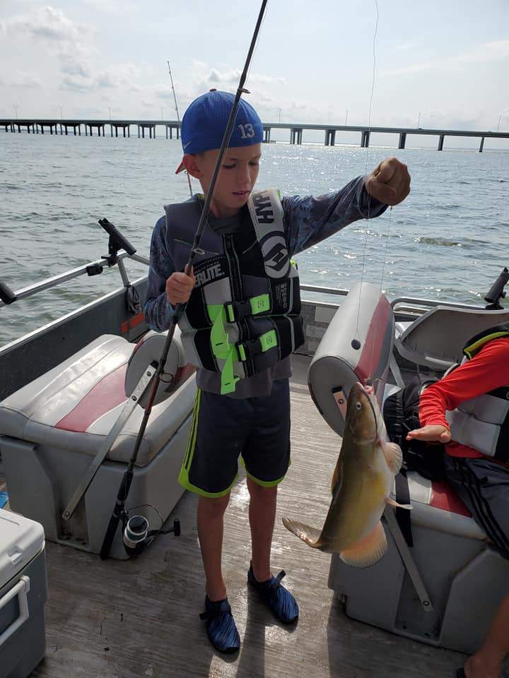 Person with fishing rod at Port Clinton