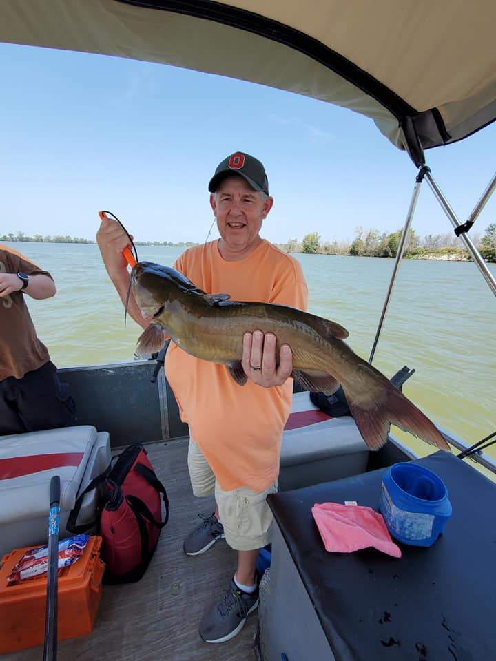 Angler holding a 29-inch catch in Port Clinton
