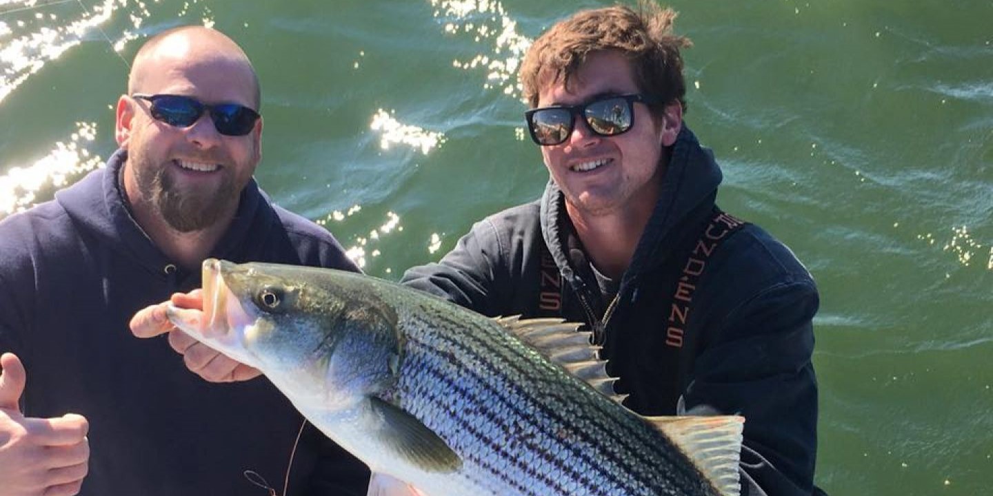 Striped bass caught by two people at Point Pleasant Beach