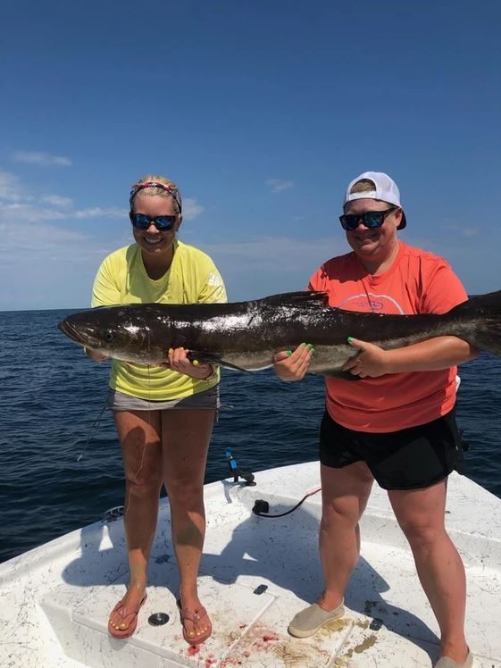 Two people fishing in Pensacola