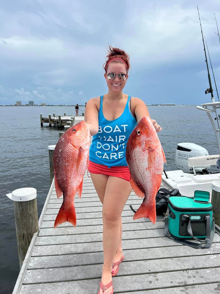 Two big fishing rods with 2 fish caught in Pensacola