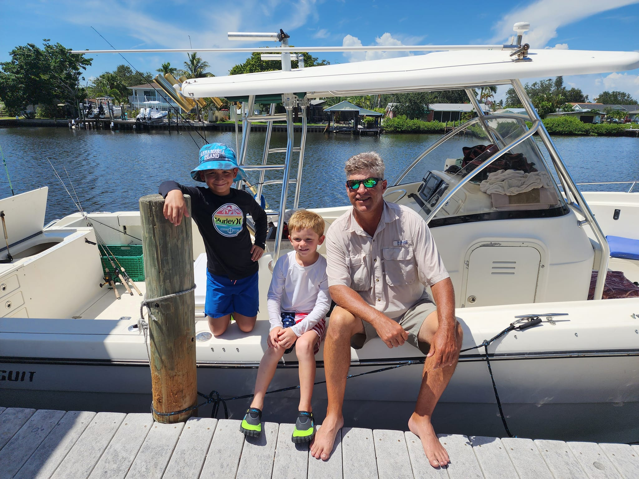 Three people enjoying a fishing tour in FL