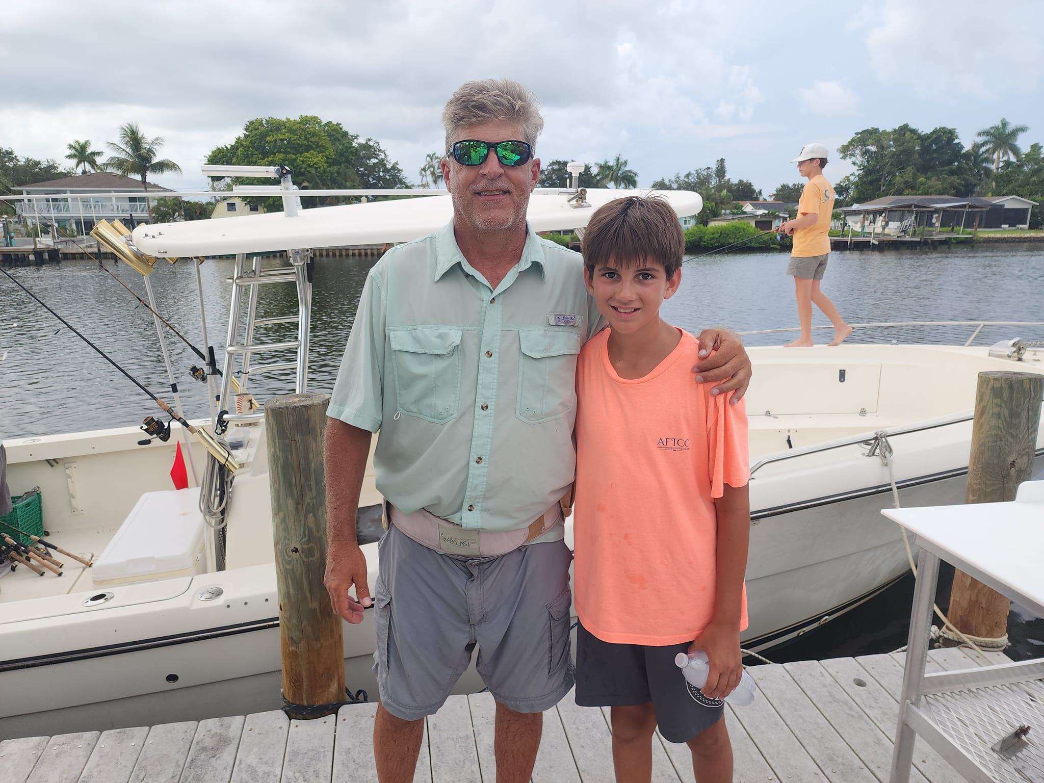 Three people enjoying a fishing tour in FL