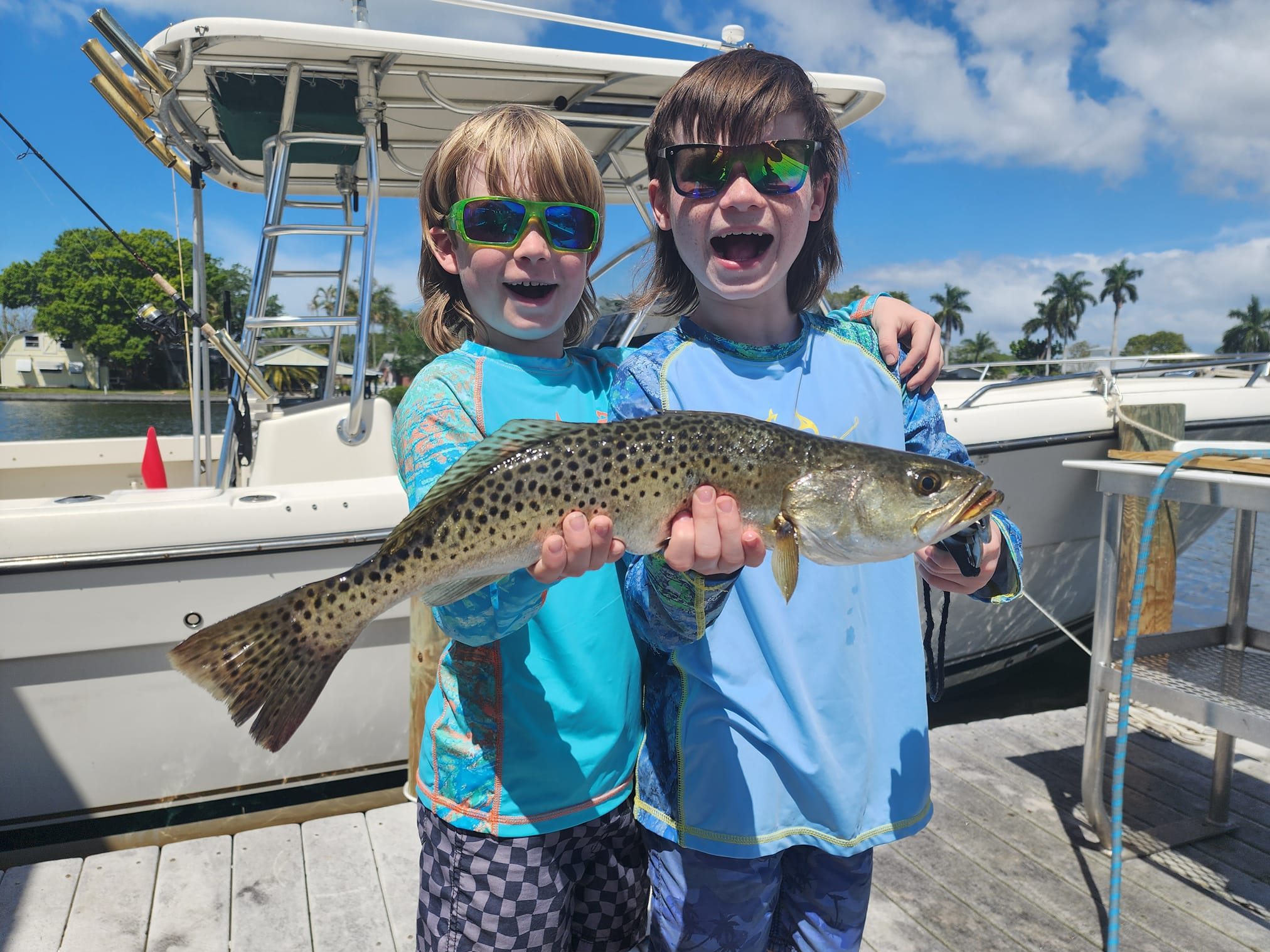 Private fishing charter boat in Bradenton waters with captain and anglers fishing for snook