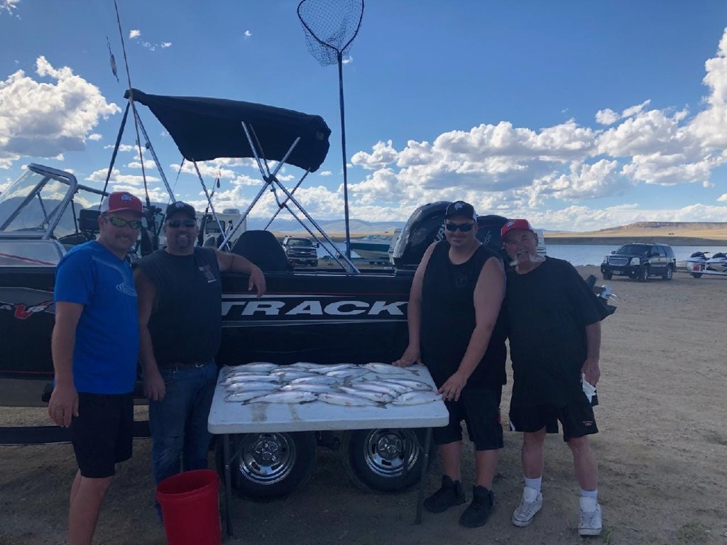 Four people enjoying fishing in Laramie