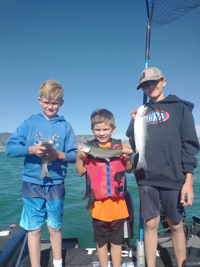 A group of 3 people fishing in Laramie