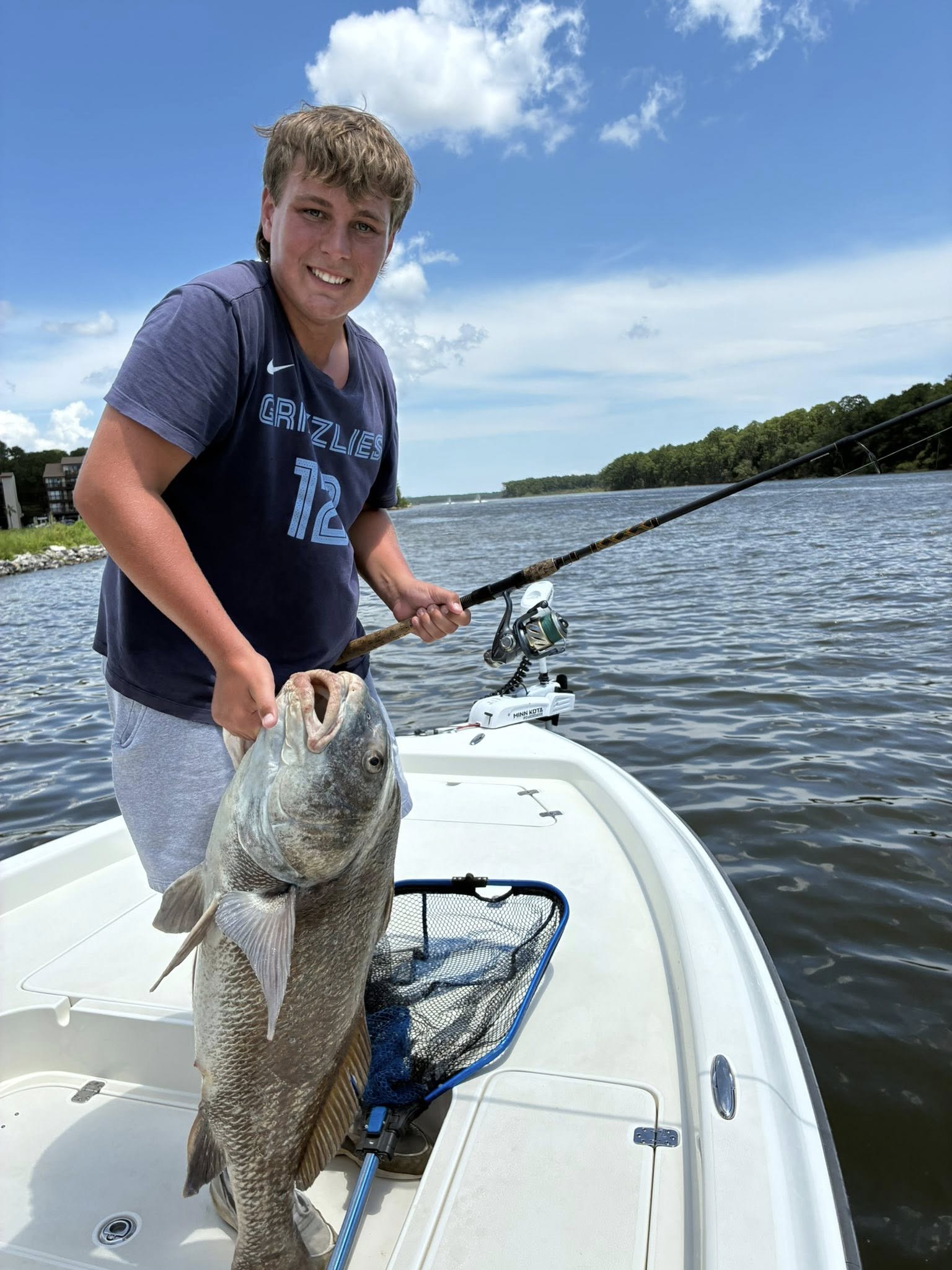 Angler with a black drum fish in Gulf Shores