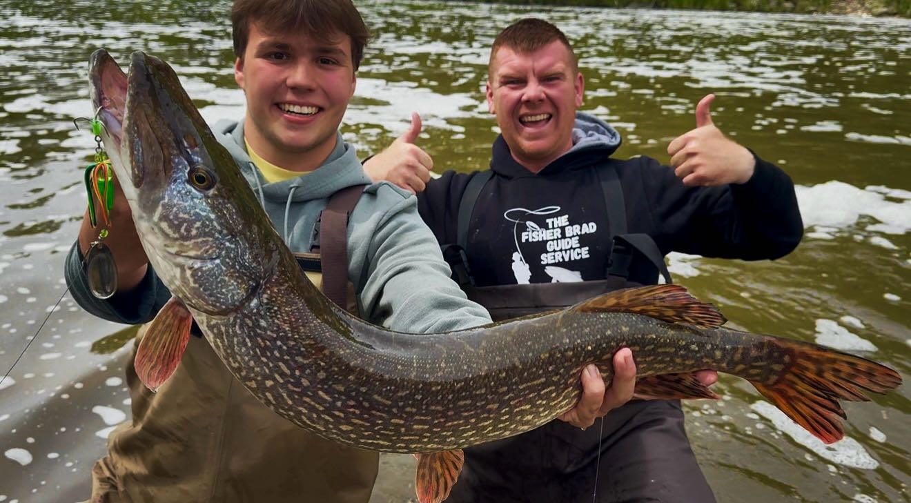 Wader fishing for northern pike, musky and bass on Black River near Port Huron Michigan