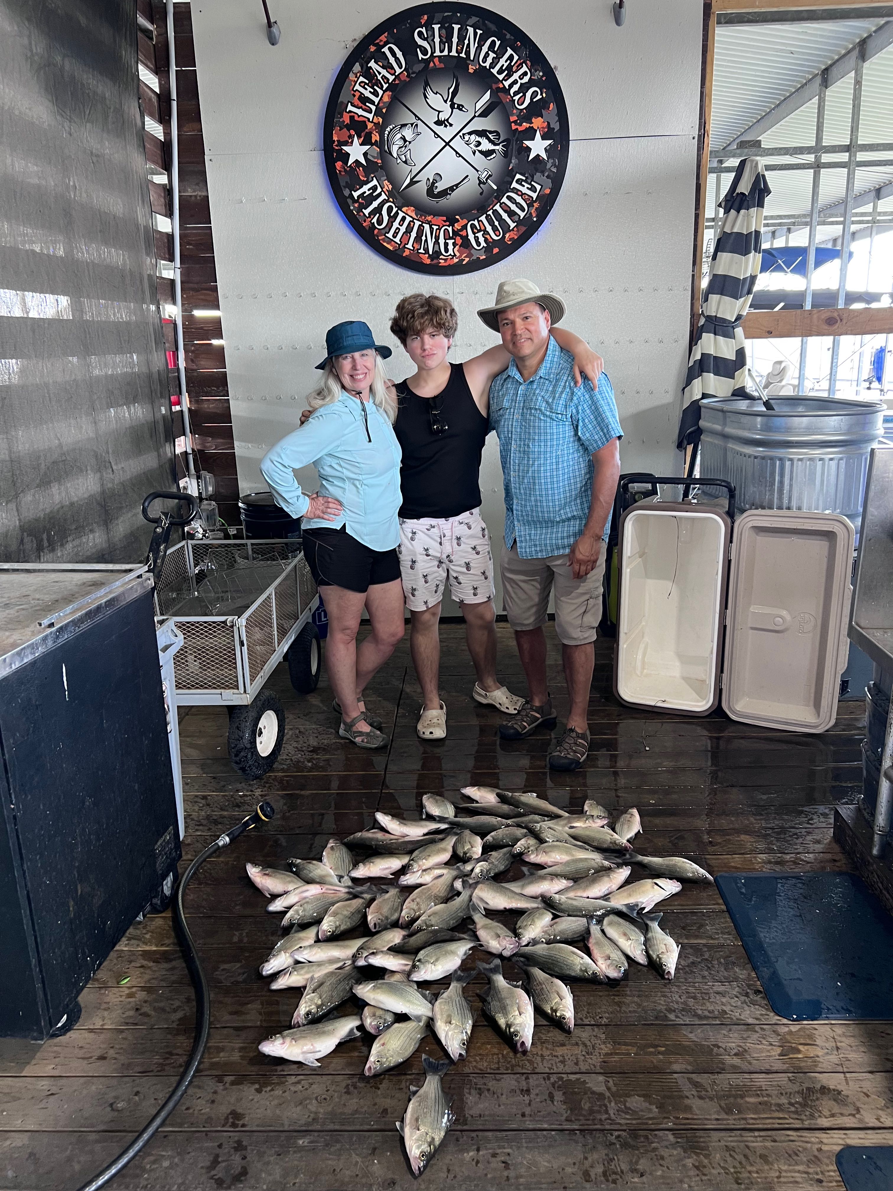 Large catch of fish displayed on fishing guide boat deck in Forney TX