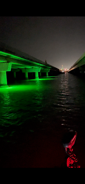 Night fishing with green light buoys on lake catching crappie and white bass