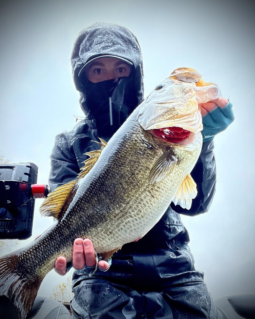 Angler reeling in a 23-inch catch in Old Forge