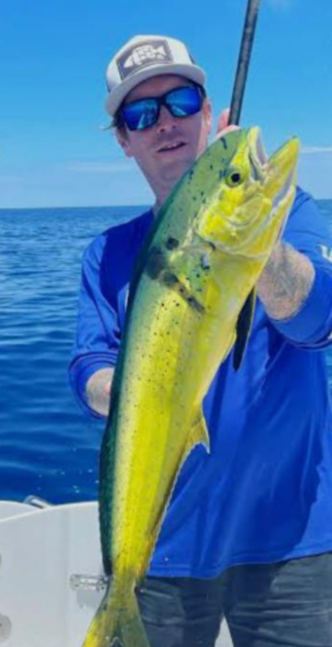 Mahi mahi catch held up on fishing boat in Clearwater FL waters