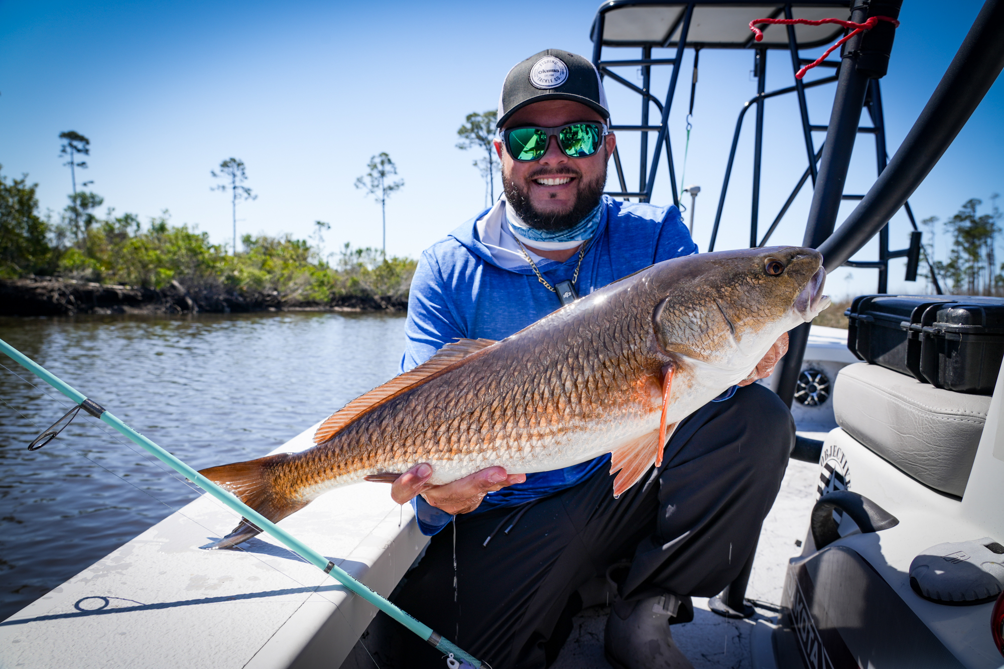 Tampa Bay inshore flats fishing charter boat with anglers targeting snook and redfish