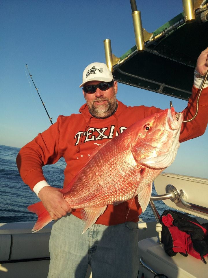 Fisherman holding a 18-inch catch in TX