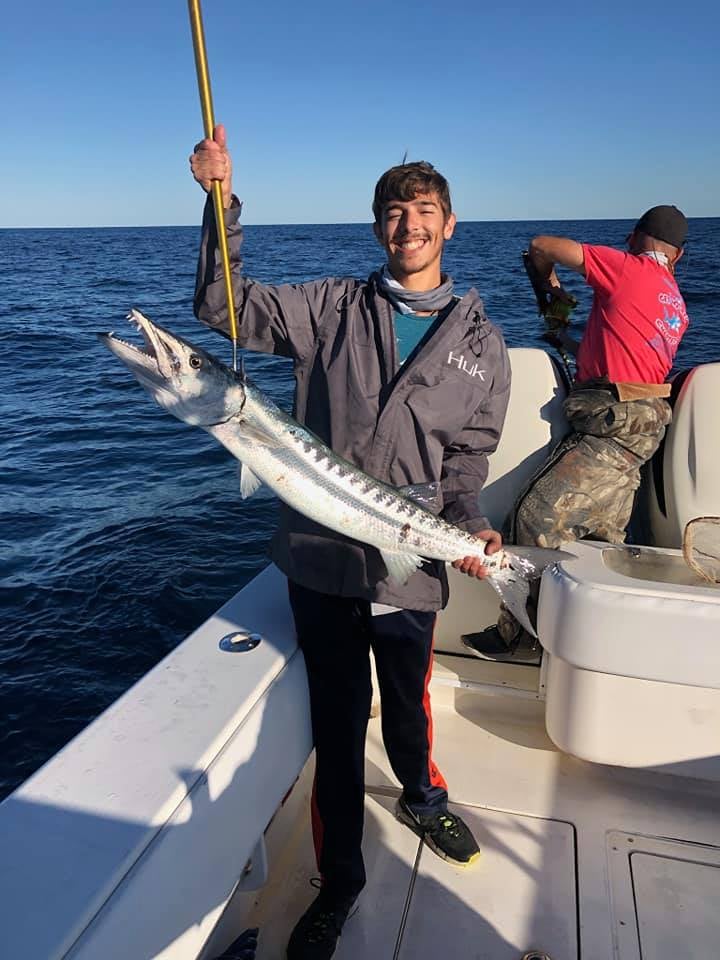 Angler with a big fish in Hitchcock