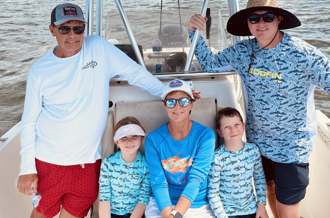 Fishing group on boat in Apalachicola FL with goldfish catch