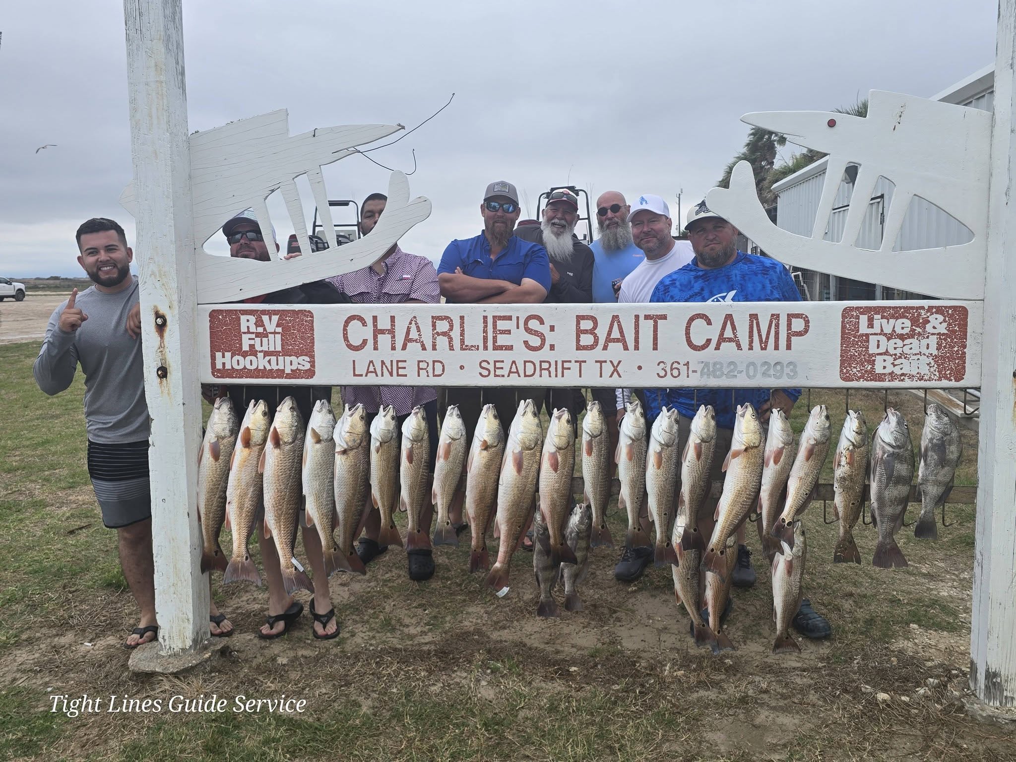 Large catch of redfish and black drum displayed at Charlie's Bait Camp in Point Comfort TX after successful fishing trip