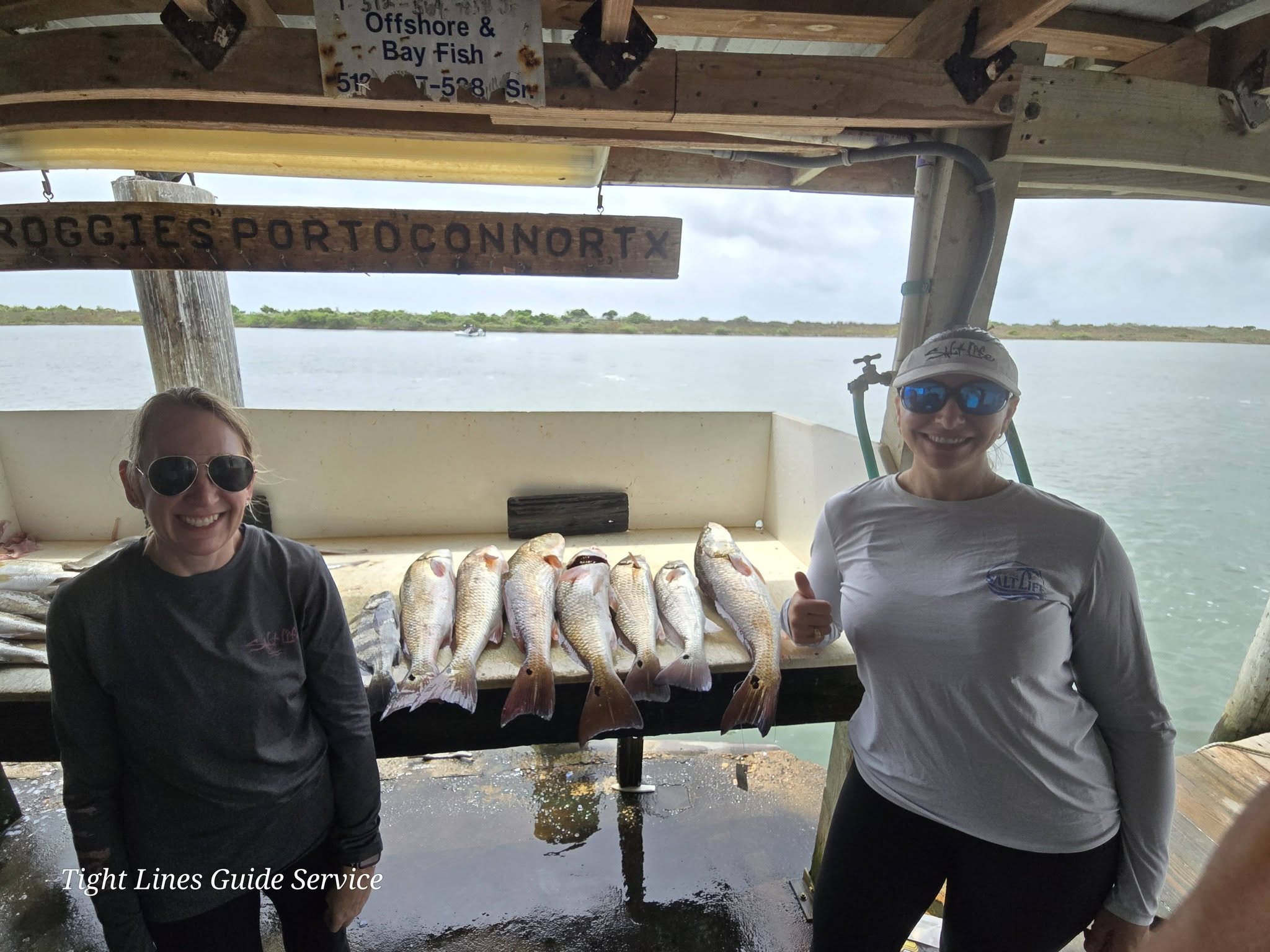 Fresh caught redfish displayed on fishing boat cleaning station at Point Comfort TX