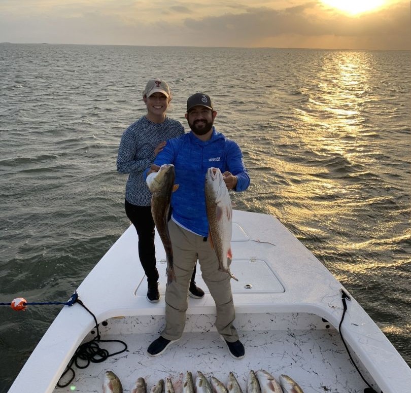 Successful redfish fishing trip on boat at South Padre Island TX with multiple fish caught