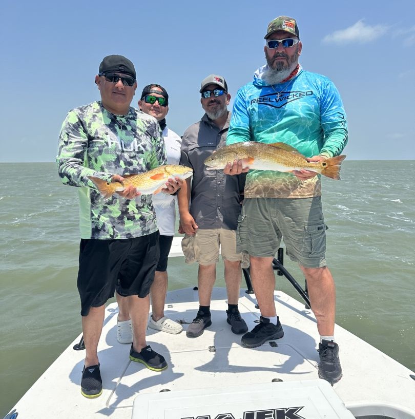 Successful redfish fishing trip on boat in South Padre Island TX waters