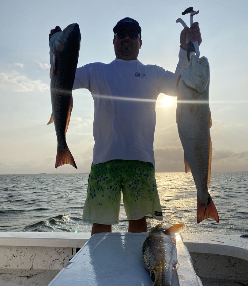 Three redfish caught during fishing trip at South Padre Island TX