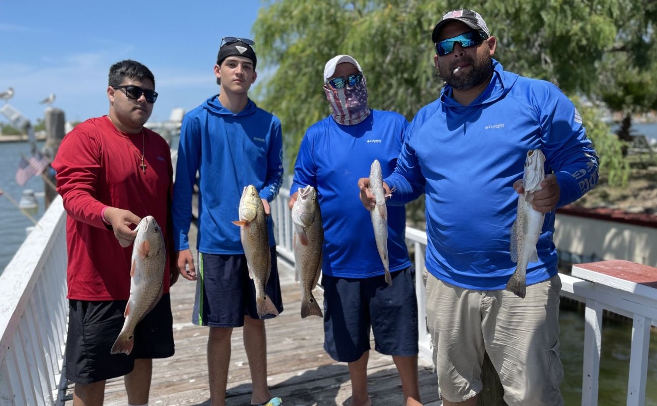 Successful fishing trip showing redfish and speckled trout catch at South Padre Island TX
