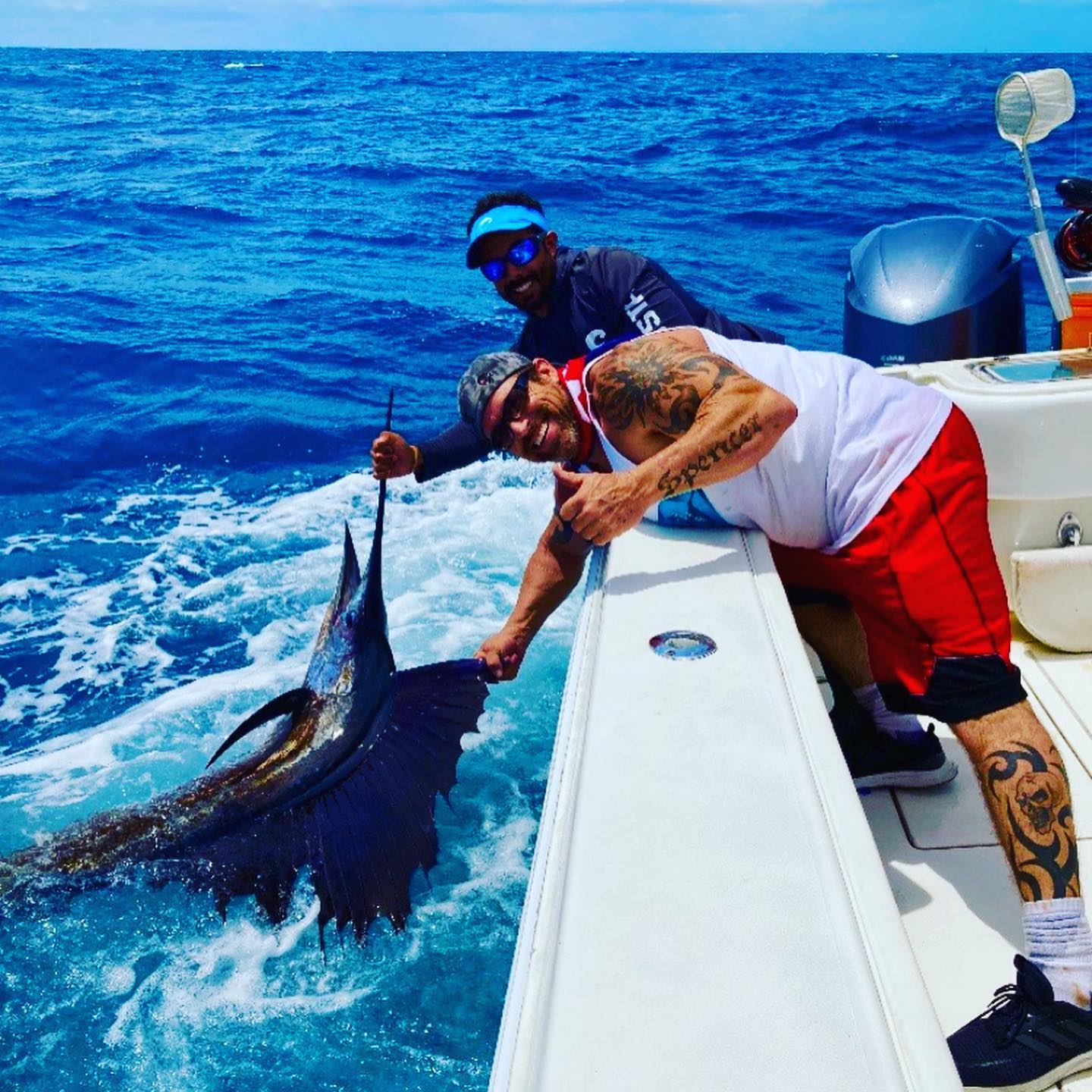 Swordfish offshore fishing charter boat in Miami deep waters with fishing gear and crew