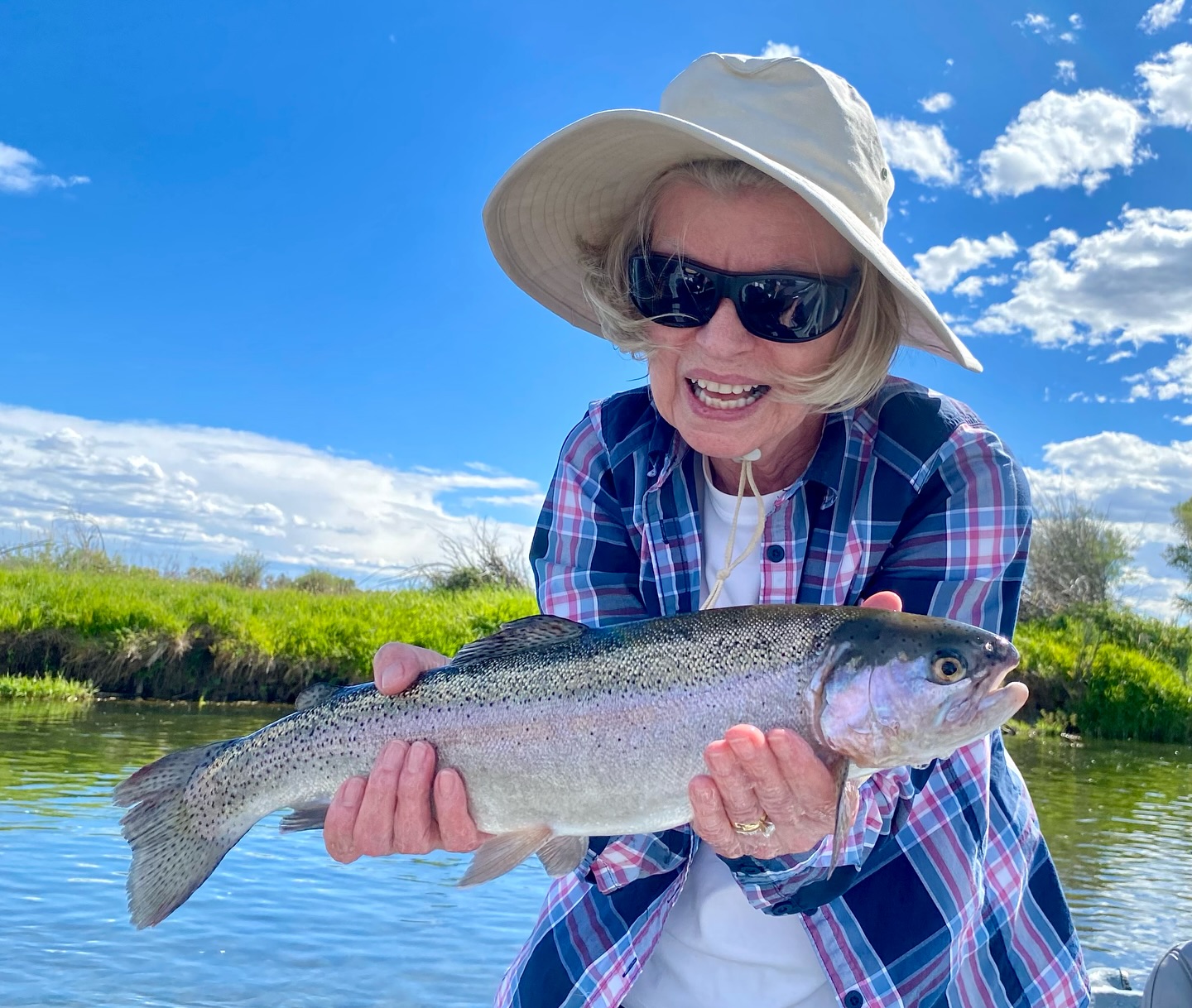 Angler with a rainbow trout catch in ID