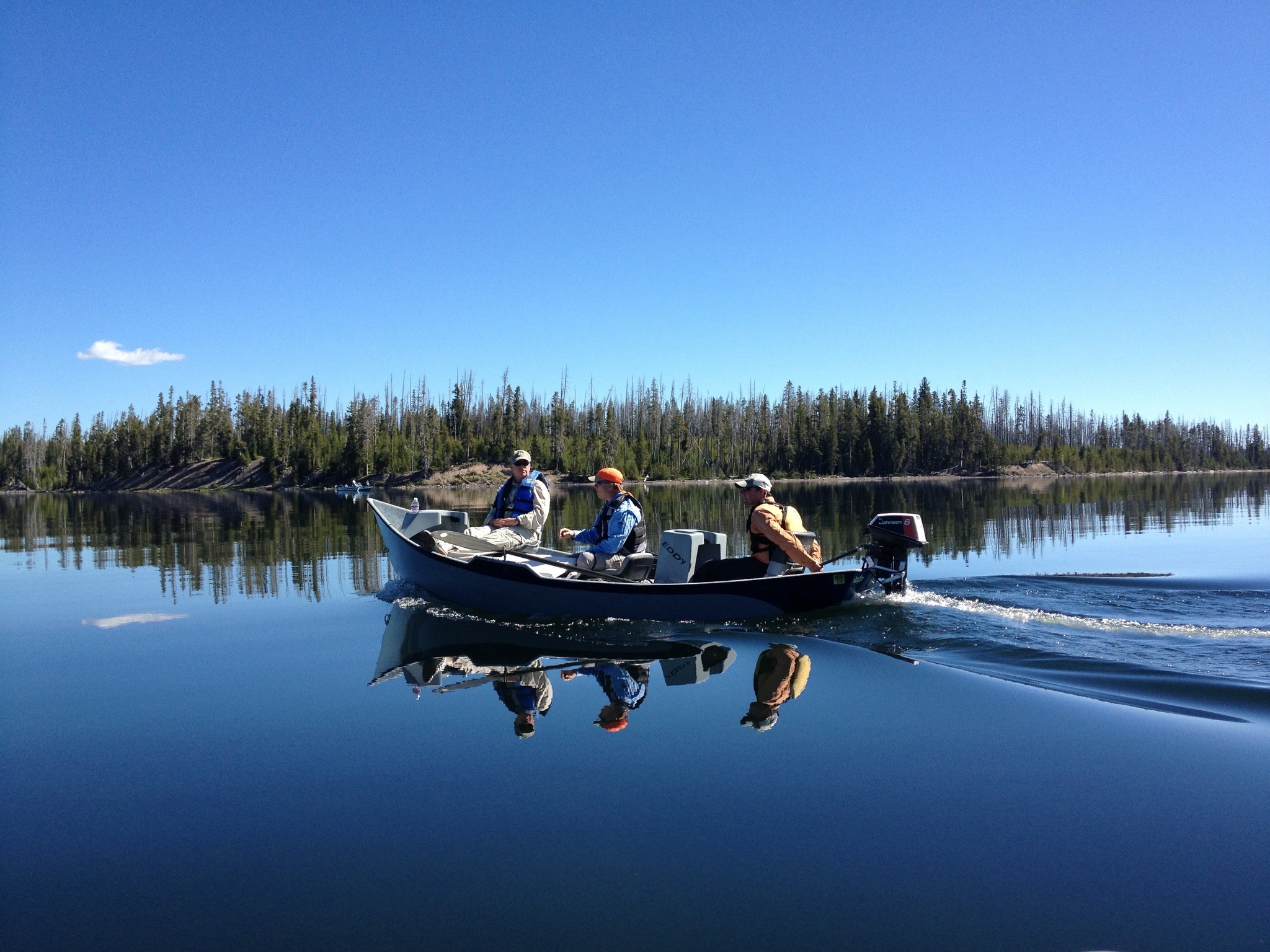 Two people fishing by the river in ID