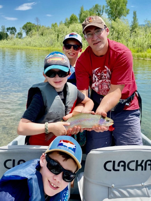 A group of 4 people fishing in Victor