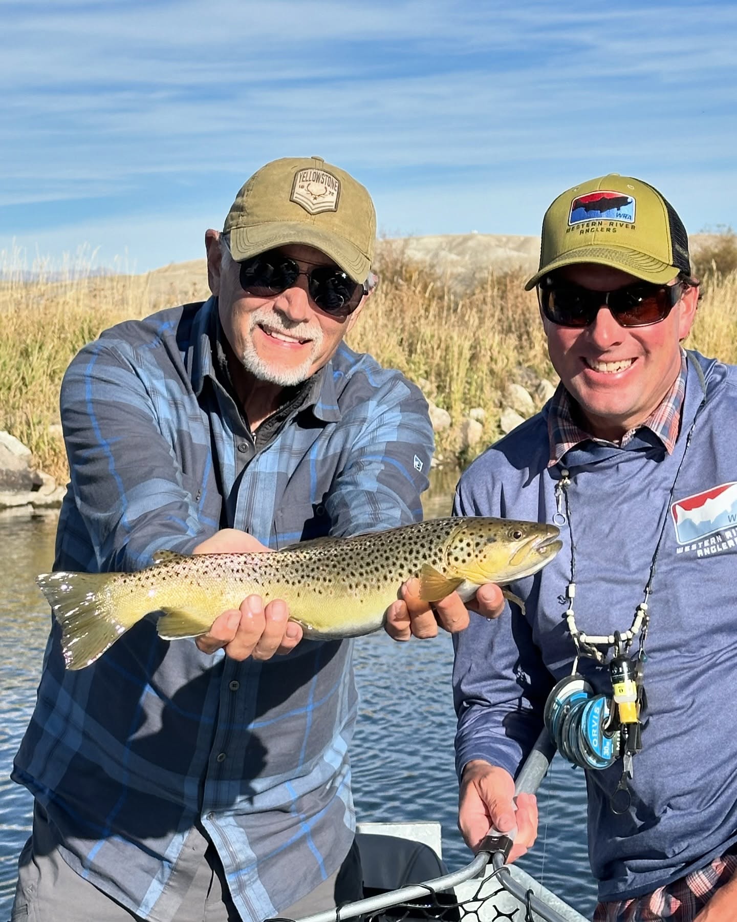 Photograph of a single rainbow trout caught by 2 people in ID