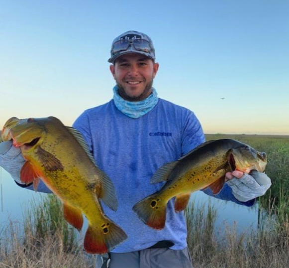 Two fishing rods with a caught fish in Miami