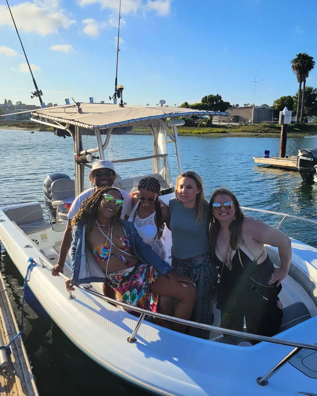 Five people fishing at Huntington Beach