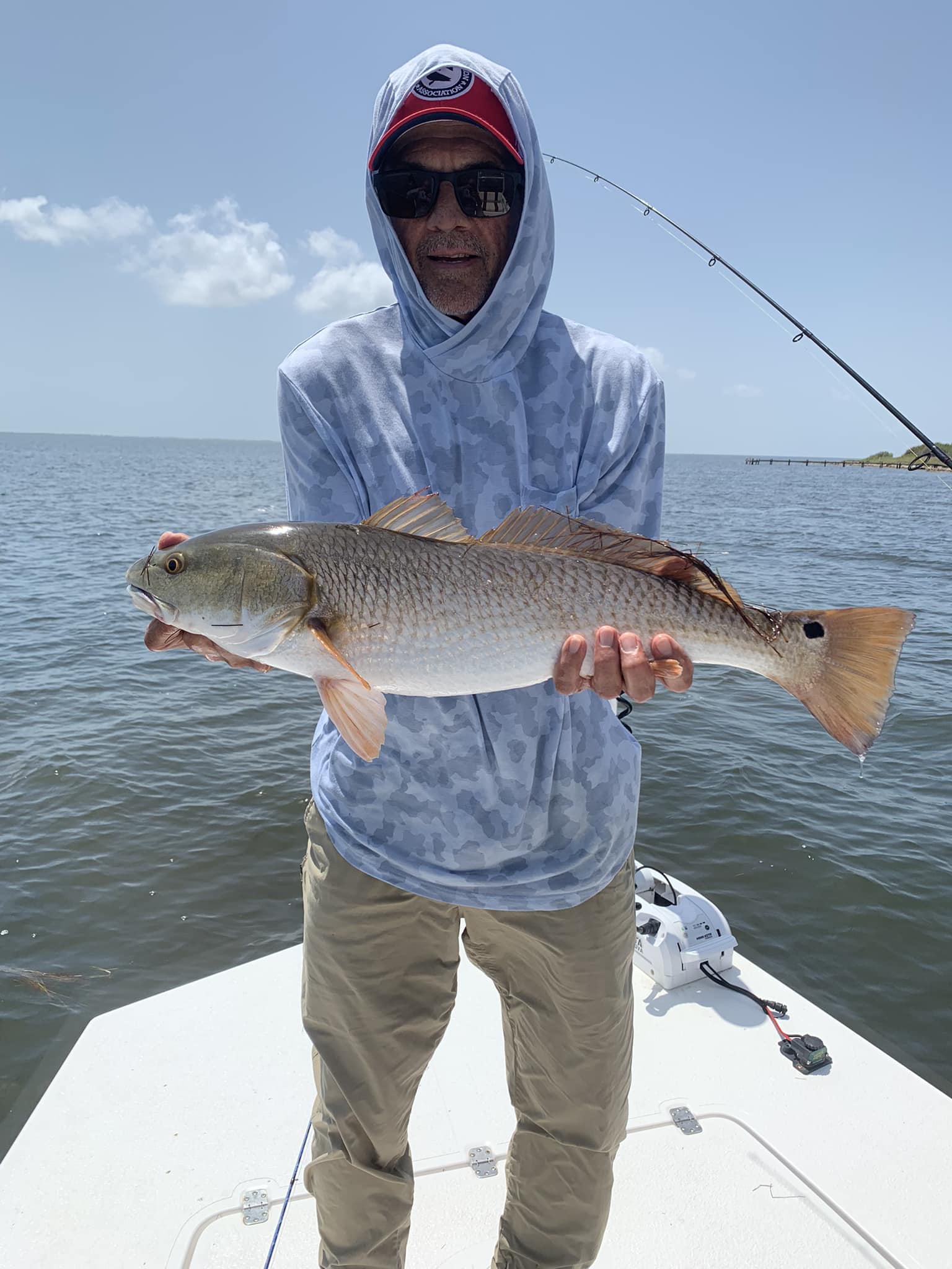 Angler with a nice 25-inch redfish in TX