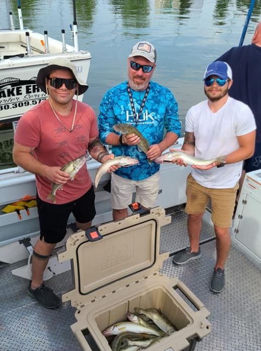 3 people enjoying a fishing trip in Lorain
