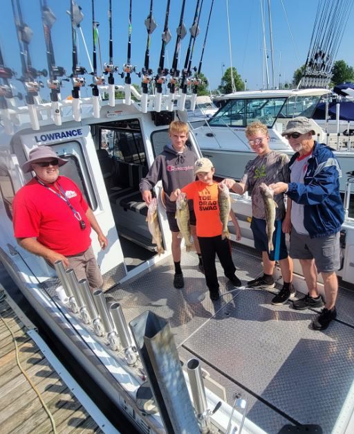 4 people enjoying a fishing trip in Lorain
