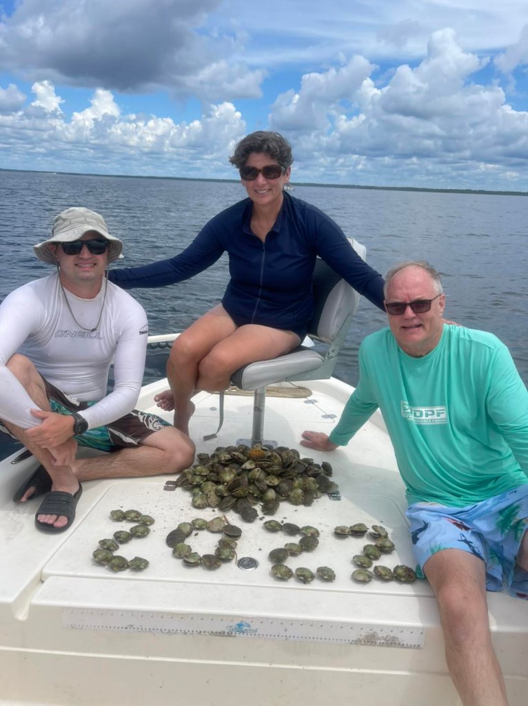 Three people enjoying the scenic beauty of Cedar Key
