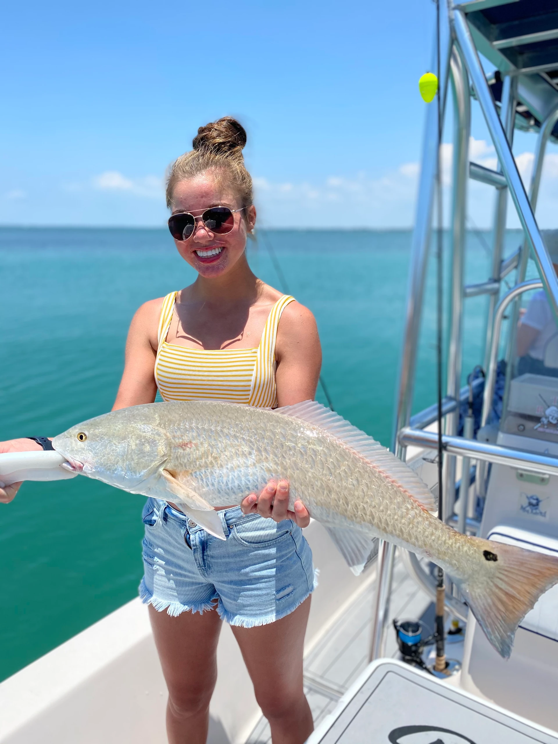 Lone fisherman catching a big fish in FL