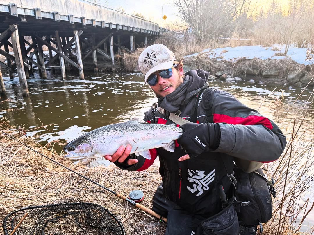 Angler with a rainbow trout caught at Niagara Falls