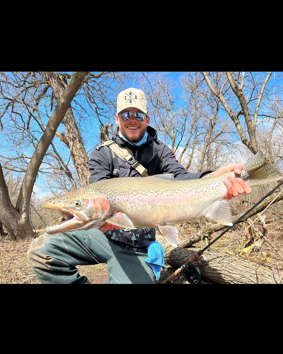 Angler with a large rainbow trout at Niagara Falls