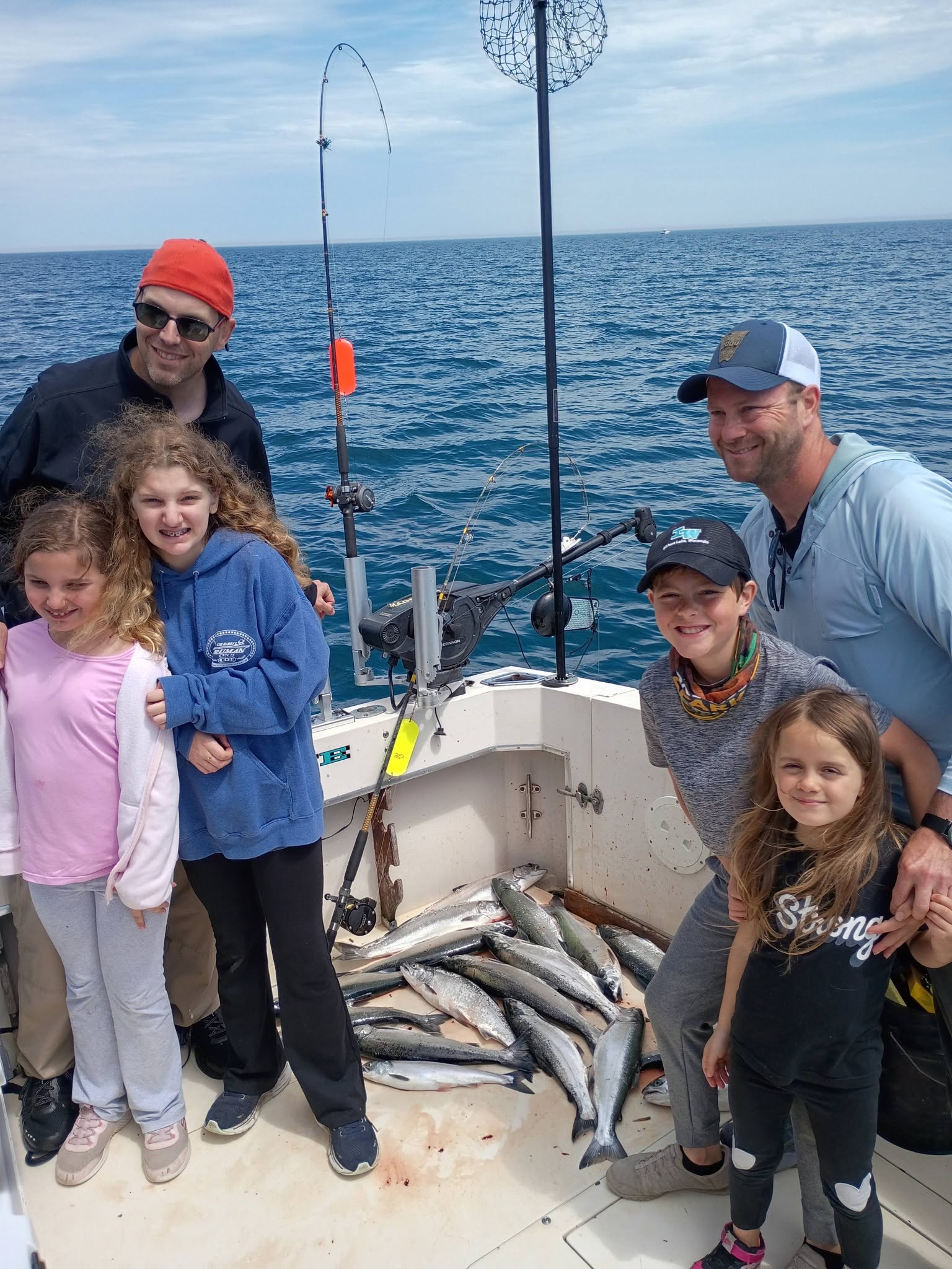 Successful fishing trip on Lake Michigan near Kenosha WI showing fresh caught fish on boat deck